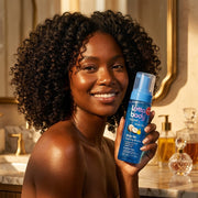 Woman with defined bouncy curls using Lottabody mousse